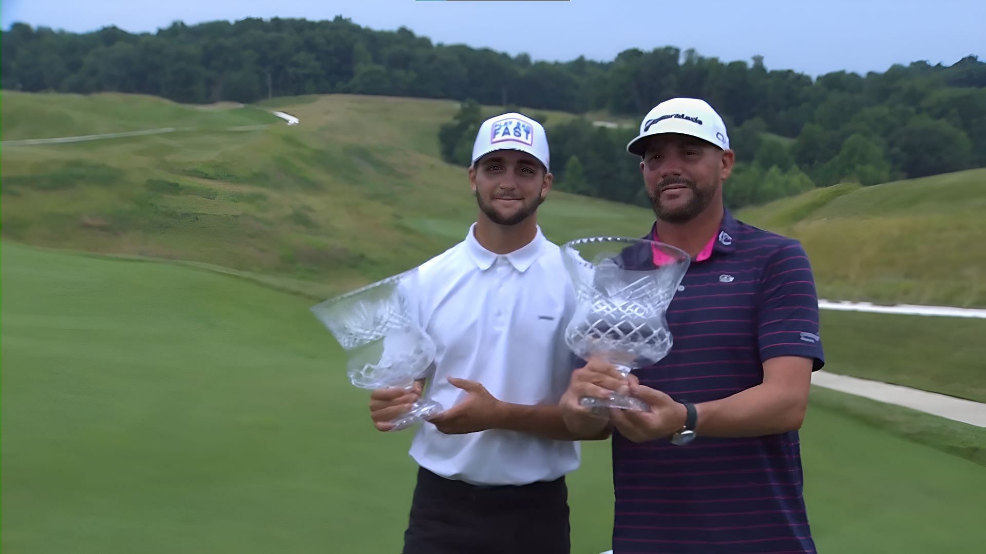 Michael Block (right) with his son pose with the trophy after winning the Good Good Gold Midwest Open (Image via Golf Channel)