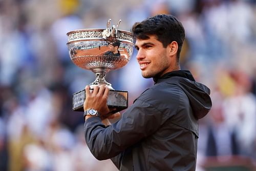 Carlos Alcaraz with the 2024 French Open trophy.