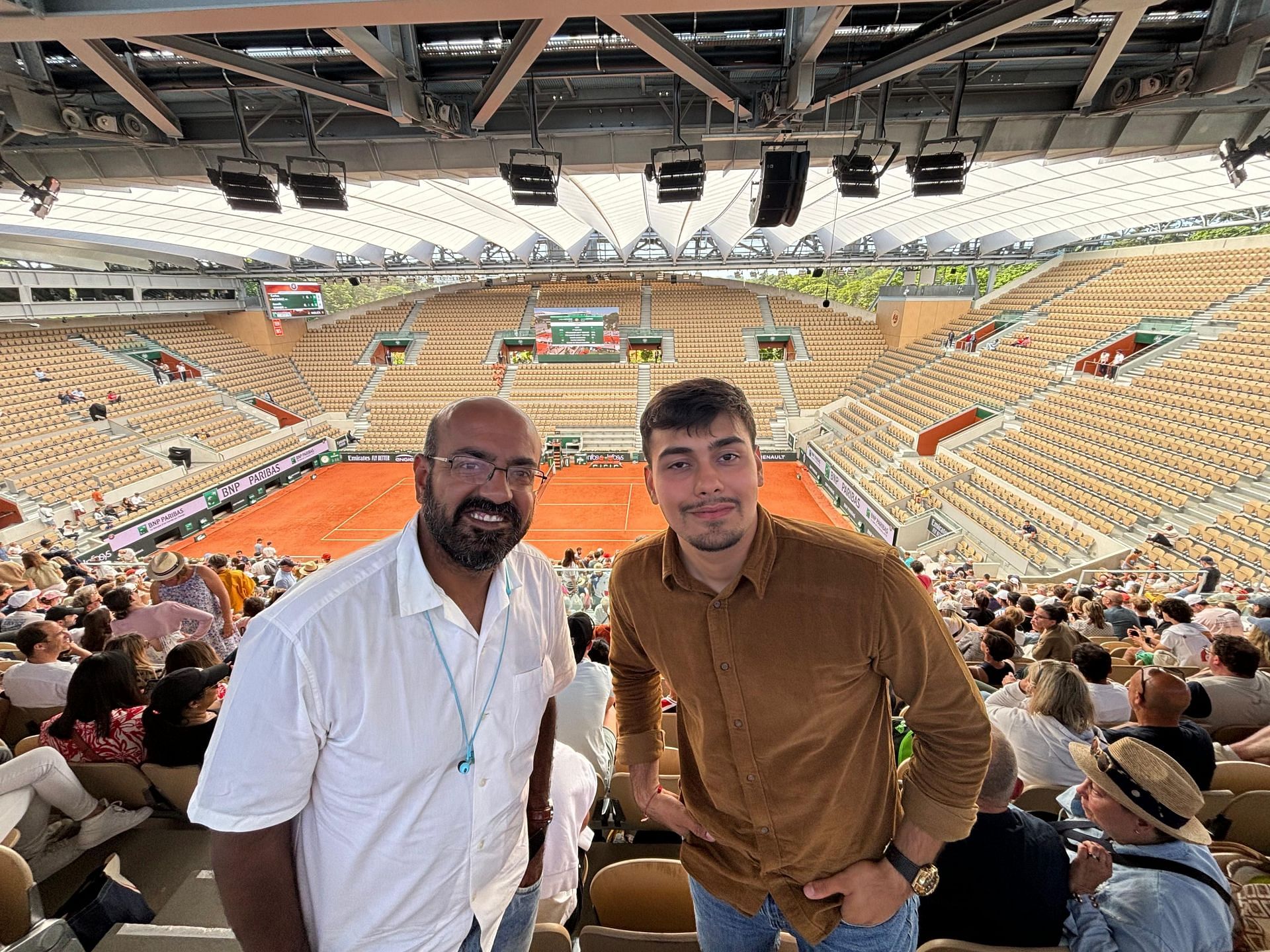 Param and me at the French Open watching the men's semi-final on the big screen