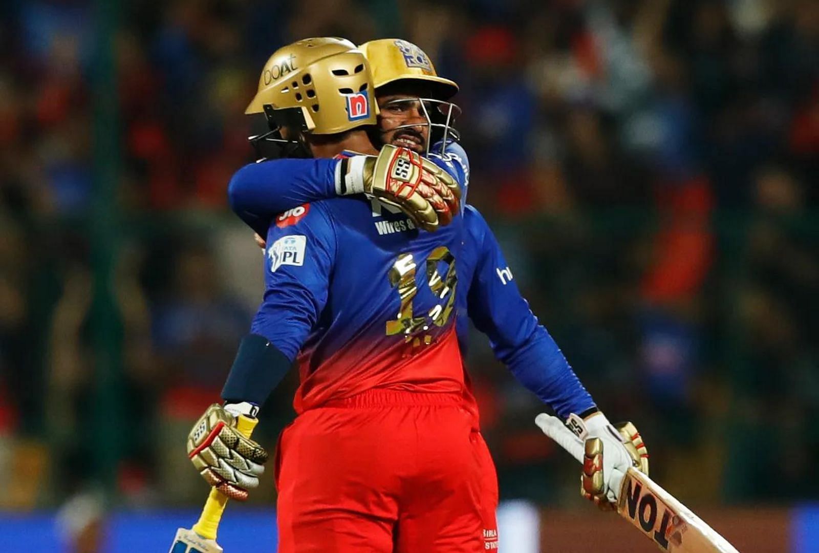 Mahipal Lomror embracing Dinesh Karthik after the duo