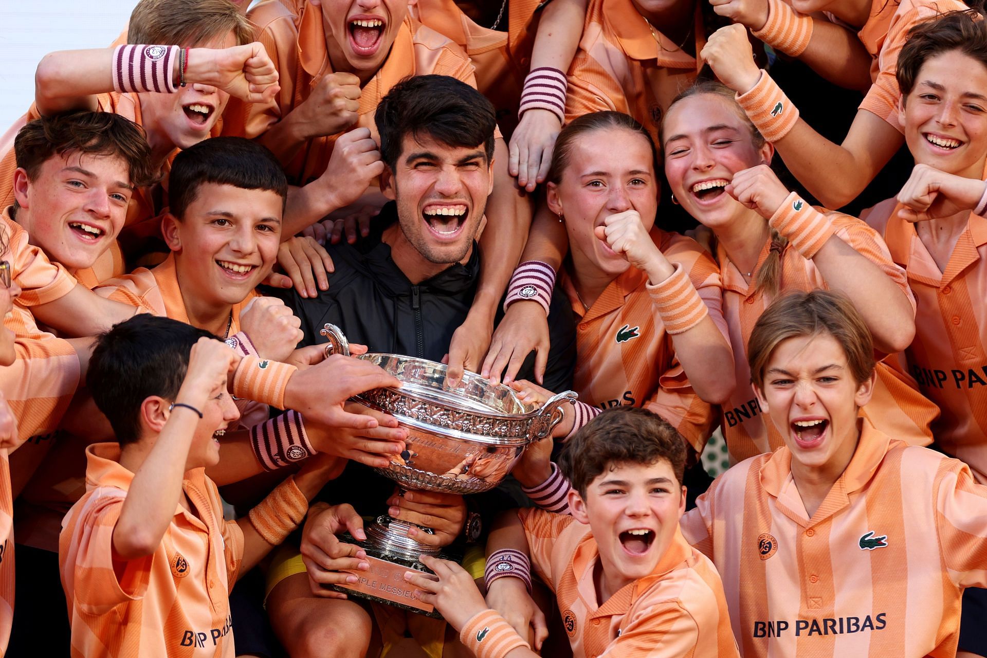 Carlos Alcaraz celebrates his 2024 French Open victory with ball kids