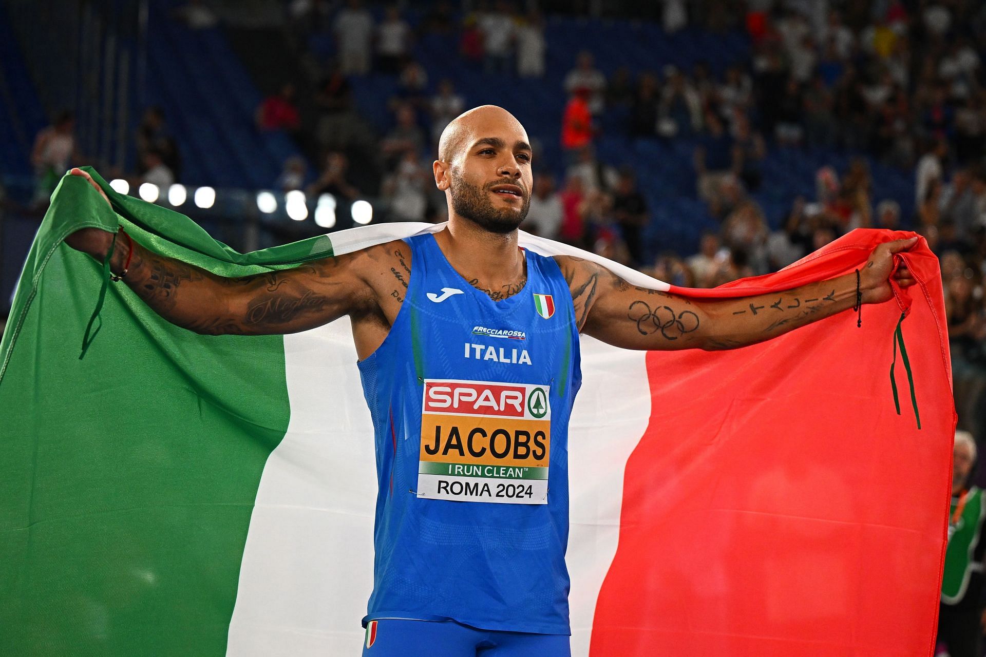 Marcell Jacobs poses for a photo after winning in the Men&#039;s 100m at the 26th European Athletics Championships in Rome, Italy.