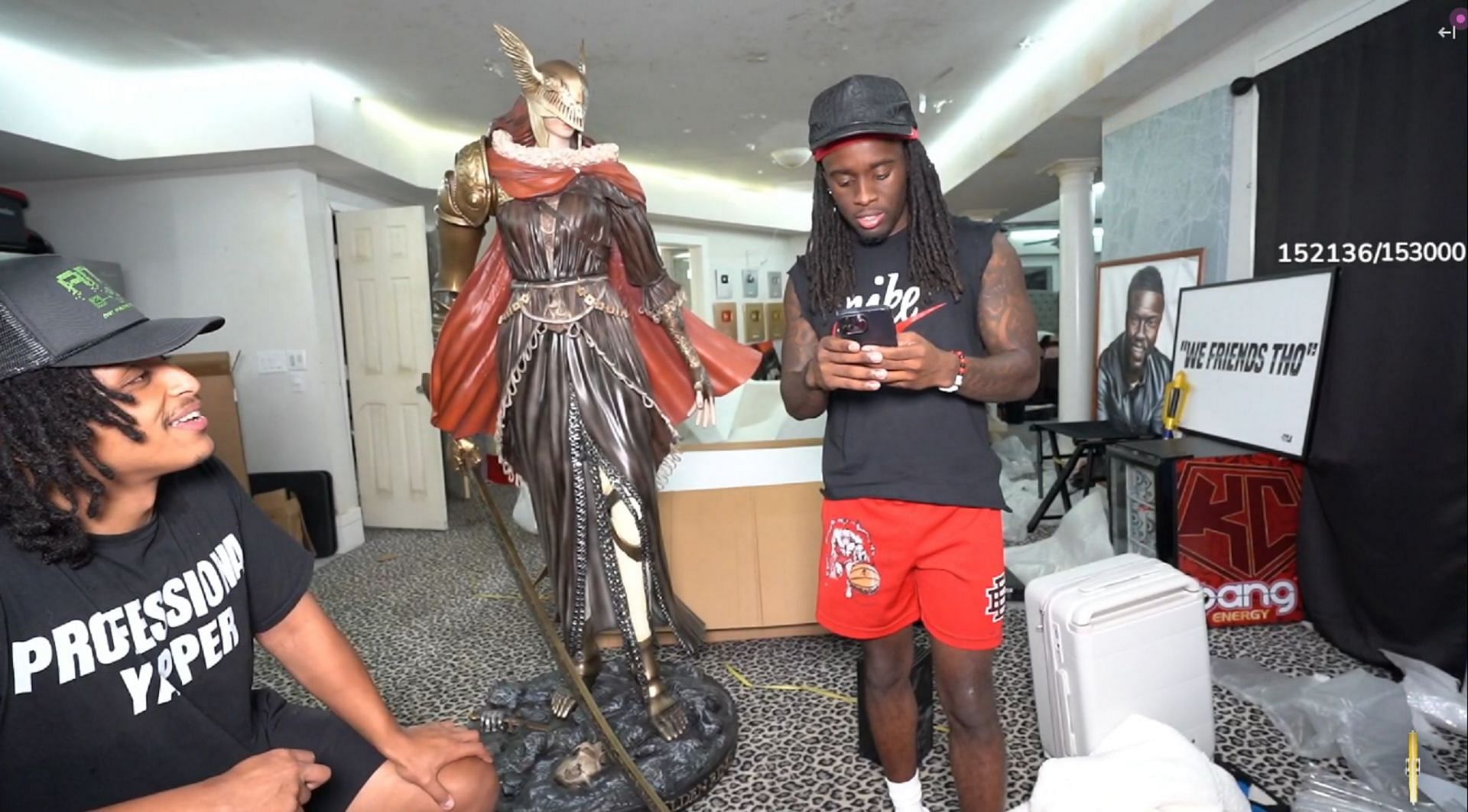 Kai Cenat assembles a life-sized Malenia statue (Image via Twitch)