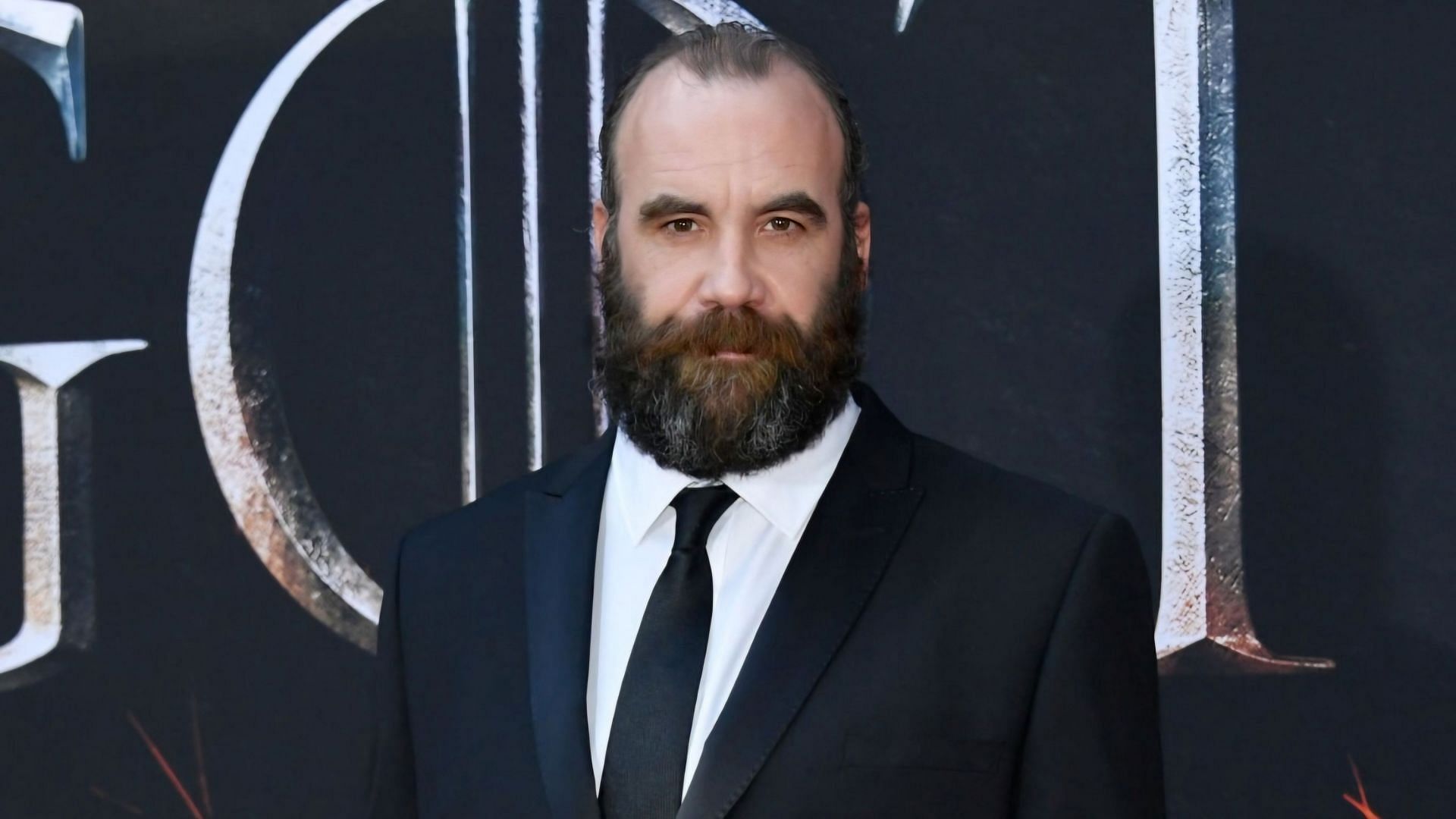 Rory McCann on a red carpet premiere for Game of Thrones (via Mike Coppola / Getty Images)