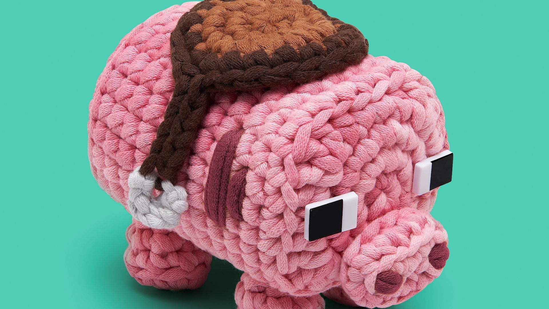 The Pig Crochet Kit with saddle accessory in the Minecraft Pig Saddle Up bundle (Image via Mojang/The Woobles)