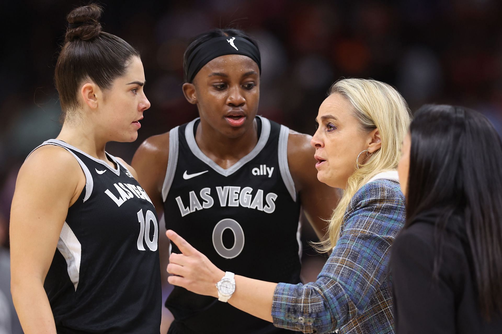 Las Vegas Aces coach Becky Hammon with guards Kelsey Plum and Jackie Young
