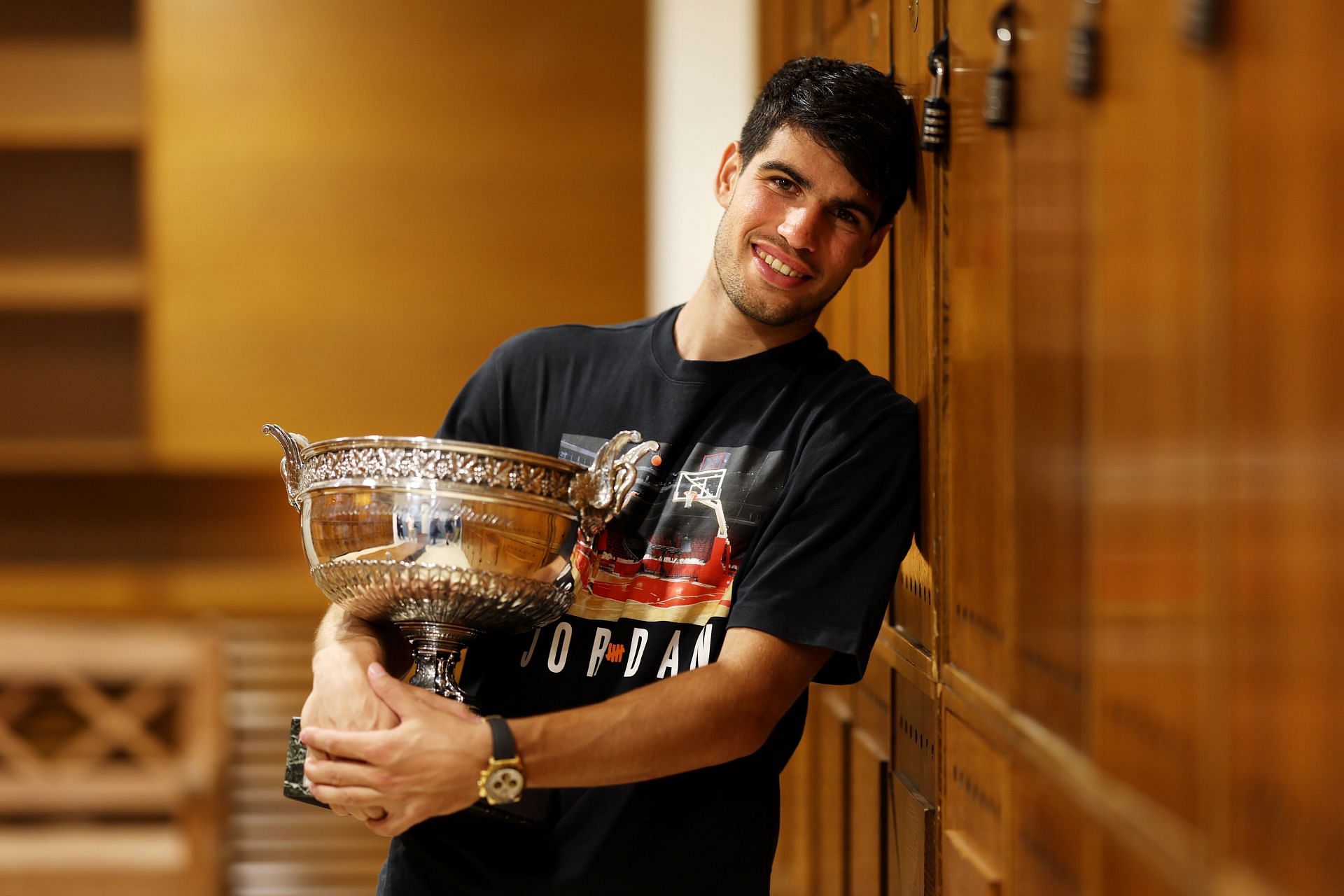 Carlos Alcaraz pictured with the 2024 French Open trophy