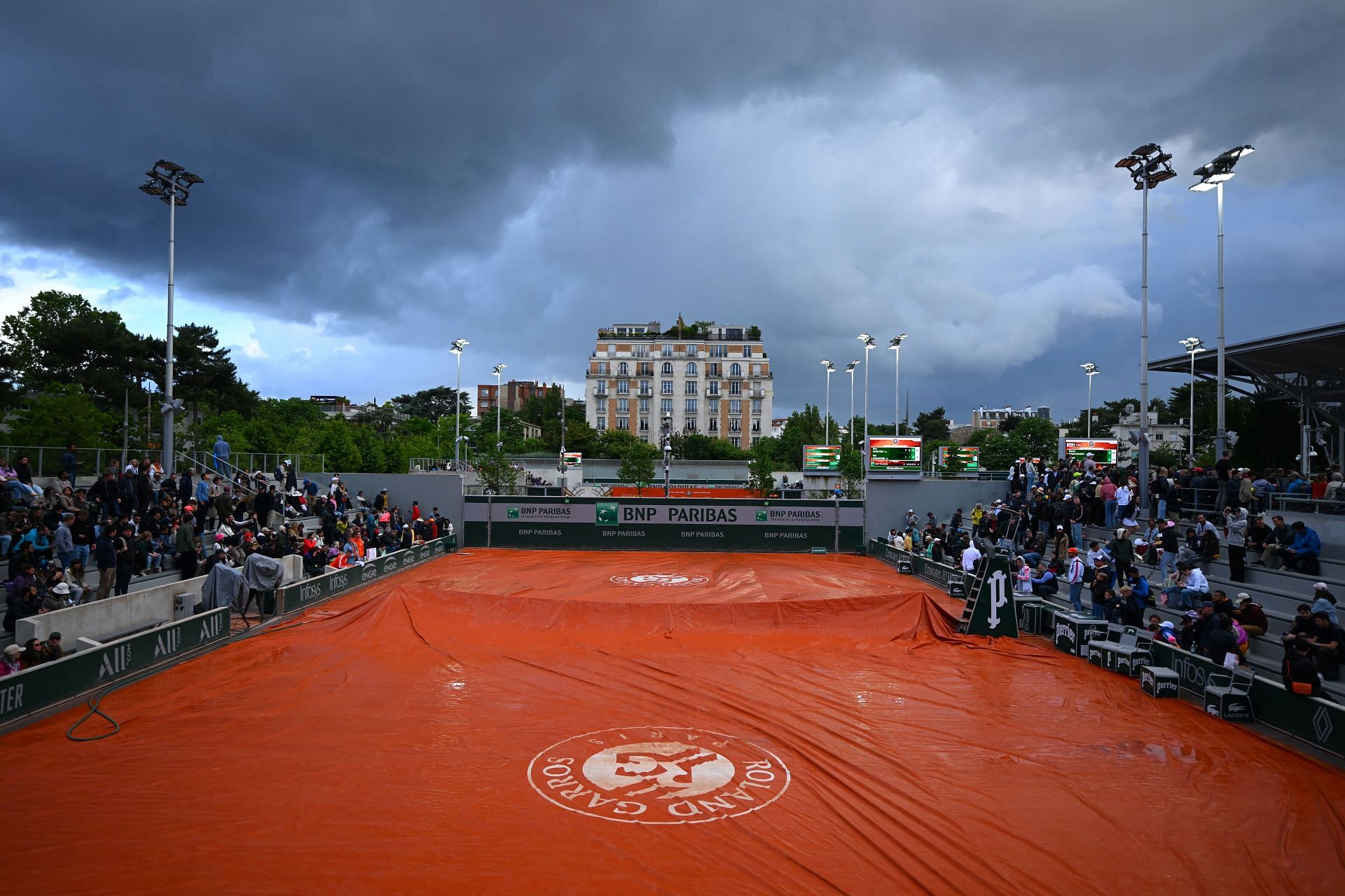 Stade Roland Garros&#039; Court 7 with rain covers on during the 2024 French Open