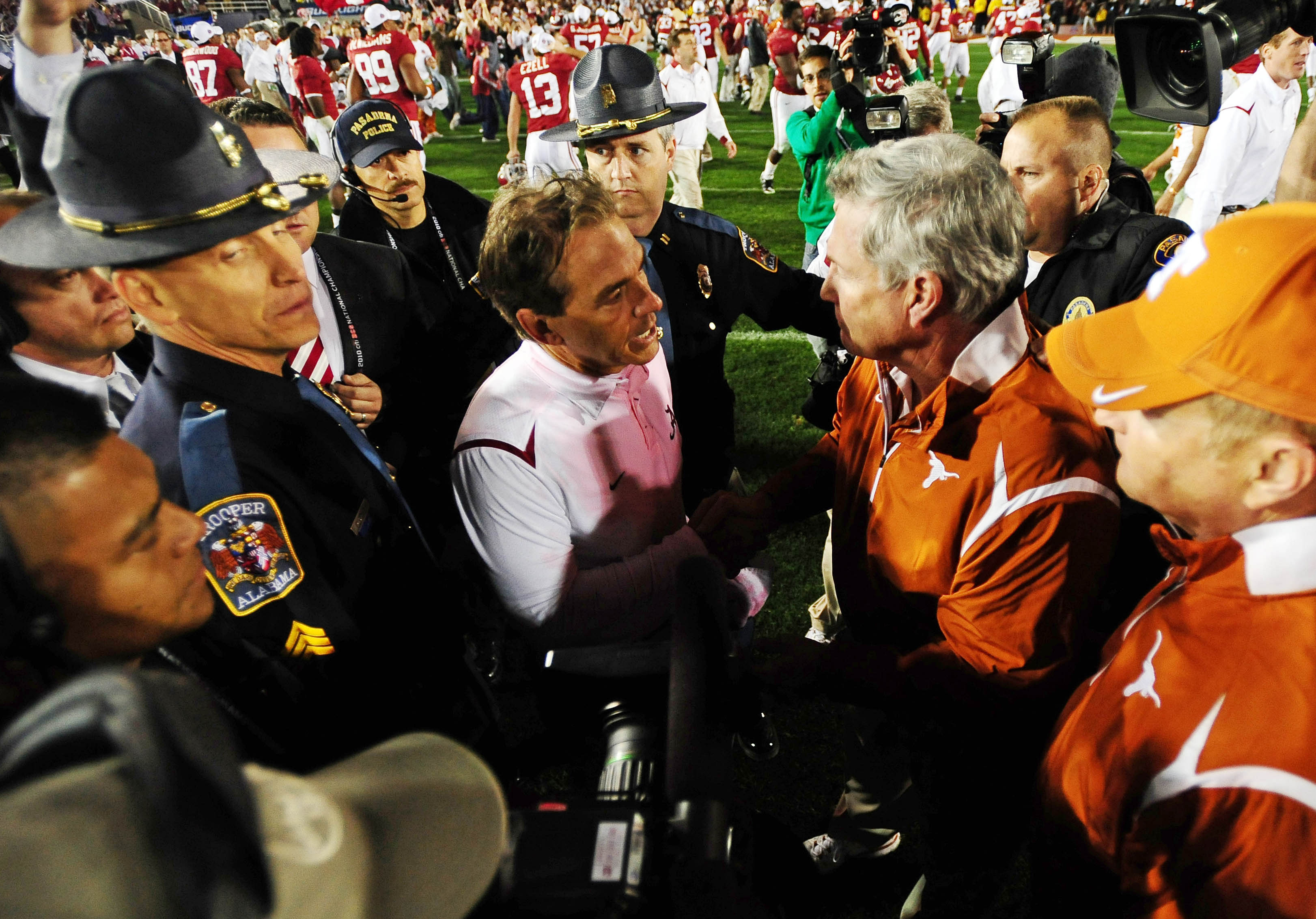 Alabama Crimson Tide head coach Nick Saban (left) shakes hands with Texas Longhorns head coach Mack Brown after the 2010 BCS national championship game.