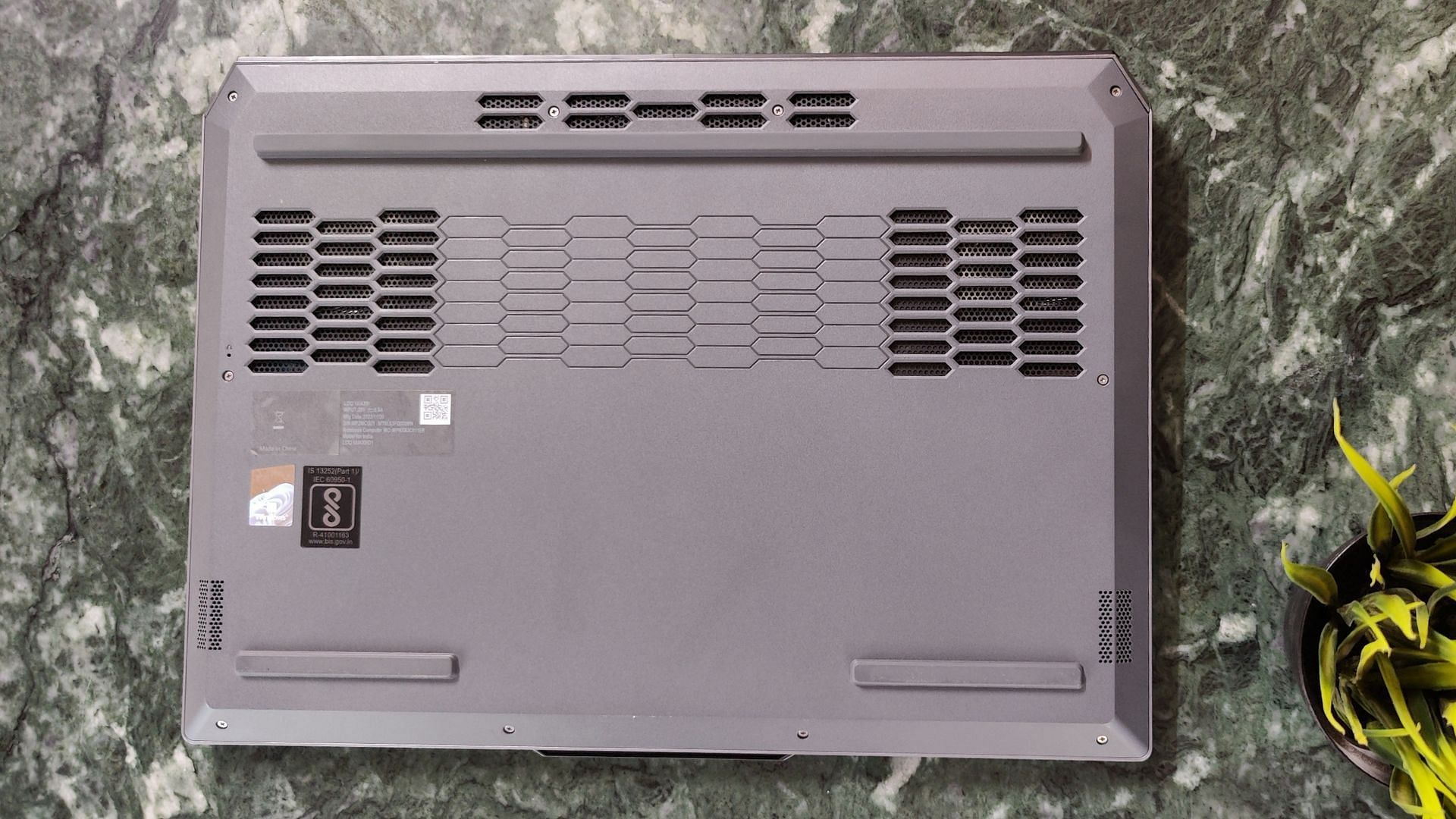 The air vents on the back of the Lenovo LOQ 15 (Image via Sportskeeda)