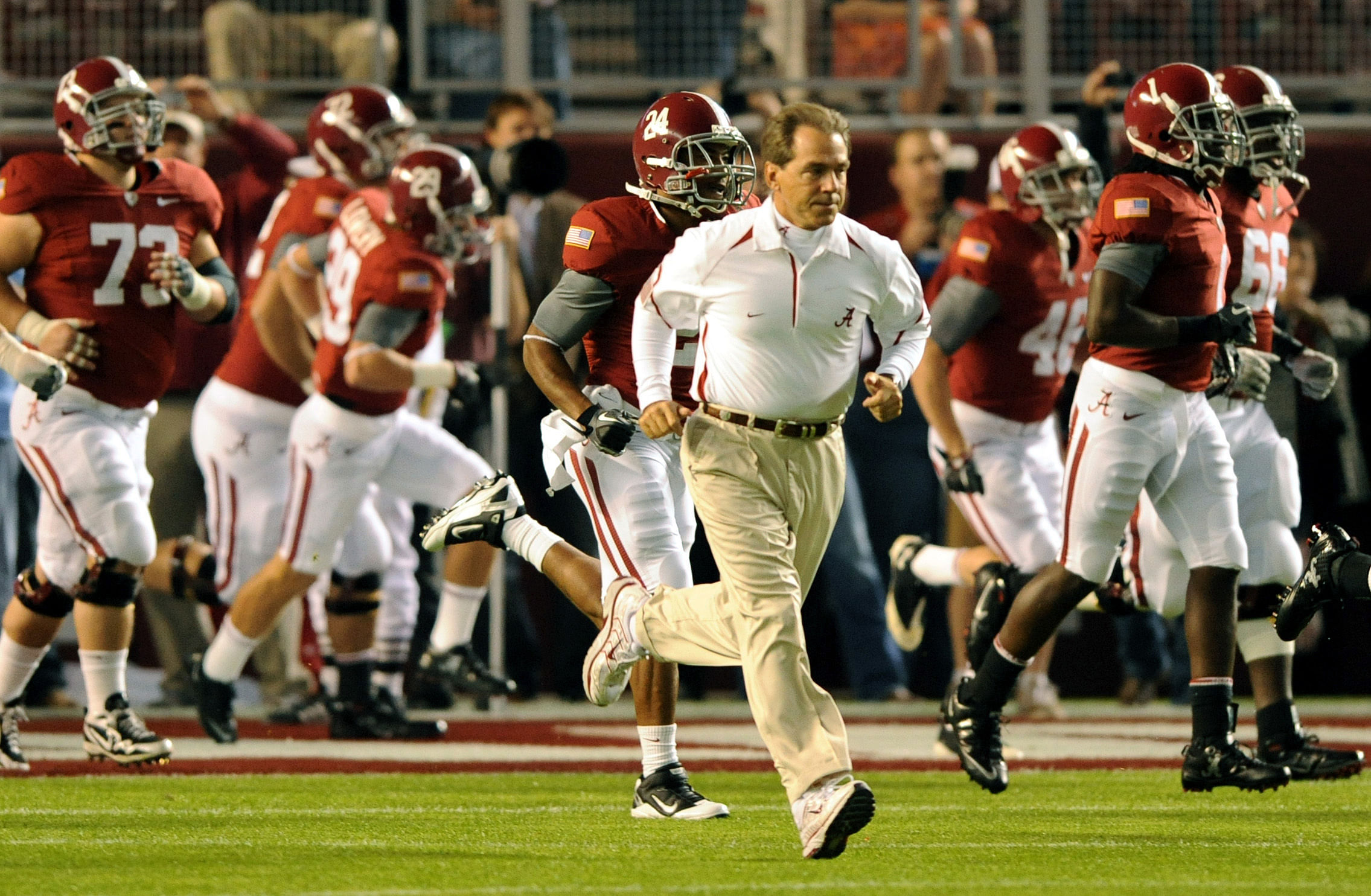 Nick Saban runs onto the field. (Credits: IMAGN)