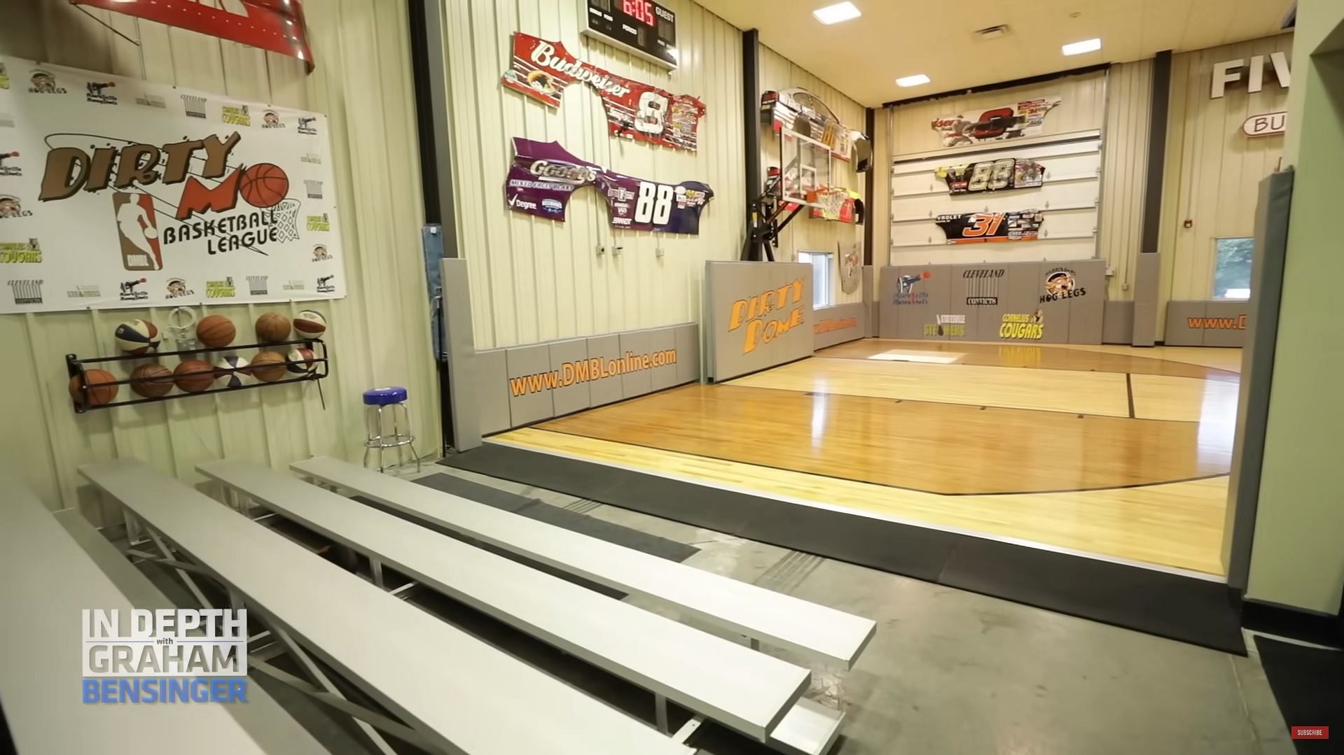 A view of the half basketball court and the used car fenders (Graham Bensinger on YouTube)