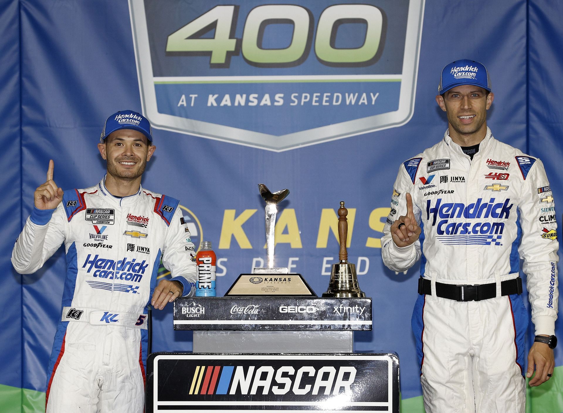 NASCAR Cup Series AdventHealth 400 KANSAS CITY, KANSAS - MAY 05: Kyle Larson, driver of the #5 HendrickCars.com Chevrolet, and crew chief Cliff Daniels celebrate in victory lane (Photo by Sean Gardner/Getty Images)