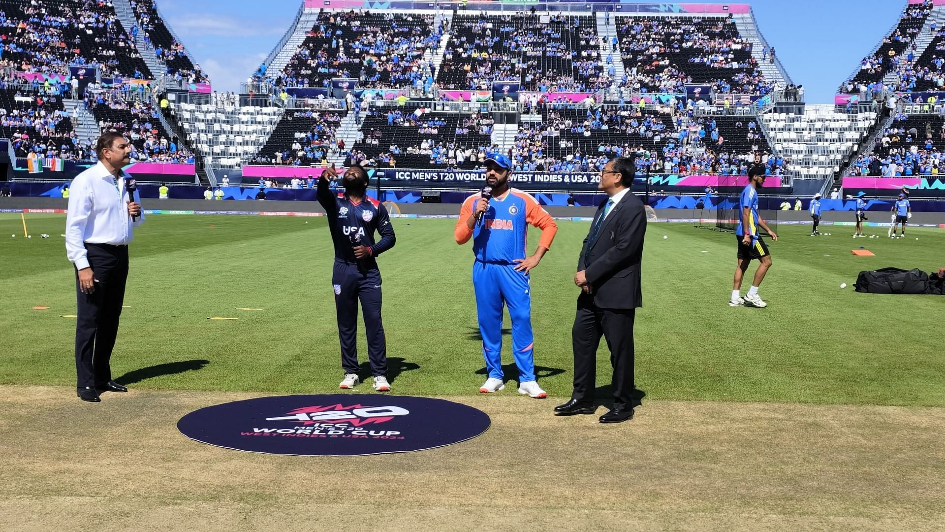 टॉस के दौरान आरोन जोन्स और रोहित शर्मा (Photo: BCCI)