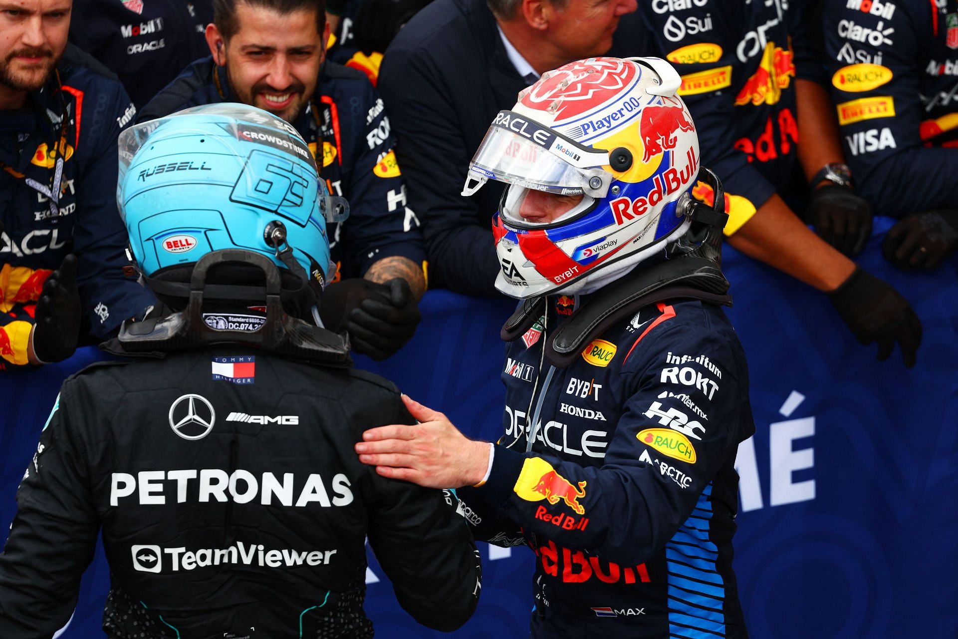 F1 Grand Prix of Canada MONTREAL, QUEBEC - JUNE 09: Race winner Max Verstappen of the Netherlands and Oracle Red Bull Racing and George Russell of Great Britain and Mercedes celebrate in parc ferme after the F1 Grand Prix of Canada at Circuit Gilles Villeneuve on June 09, 2024 in Montreal, Quebec. (Photo by Clive Rose/Getty Images)