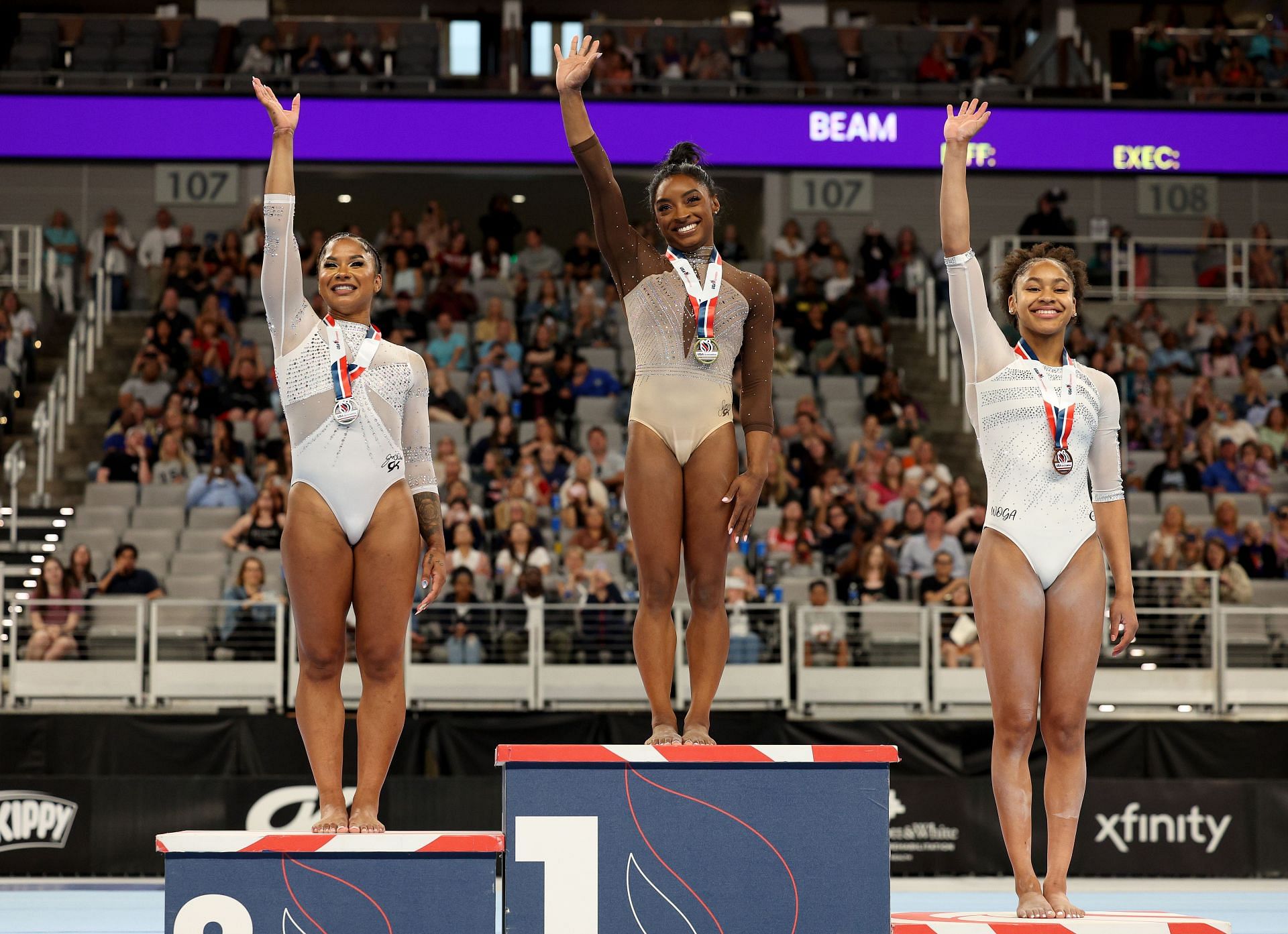 Second place winner Jordan Chiles, first place winner Simone Biles and third place winner Skye Blakely pose on the podium for the uneven bars during the 2024 Xfinity U.S. Gymnastics Championships at Dickies Arena on June 02, 2024 in Fort Worth, Texas. (Photo by Elsa/Getty Images)