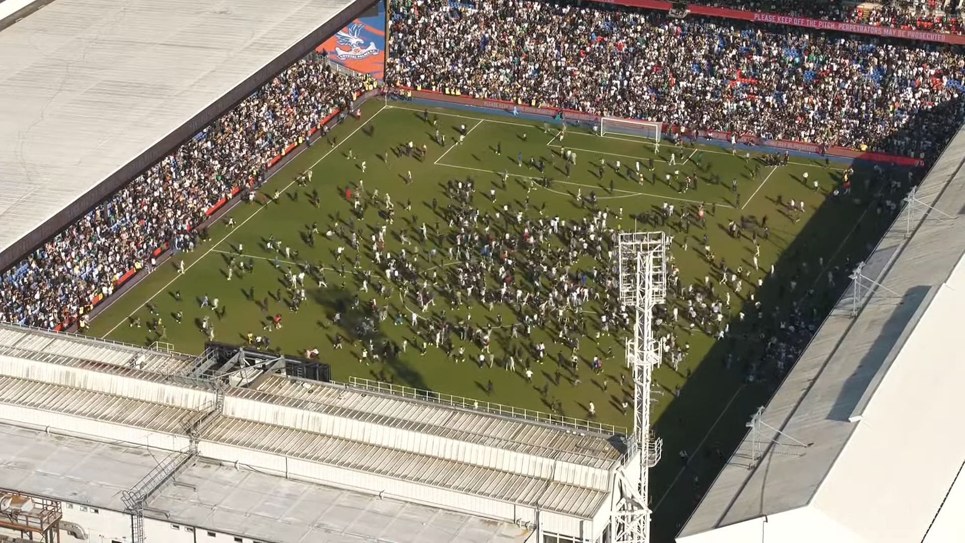 Aerial view of the pitch invasion that resulted in the match being called off (Image via Beta Squad/YouTube)