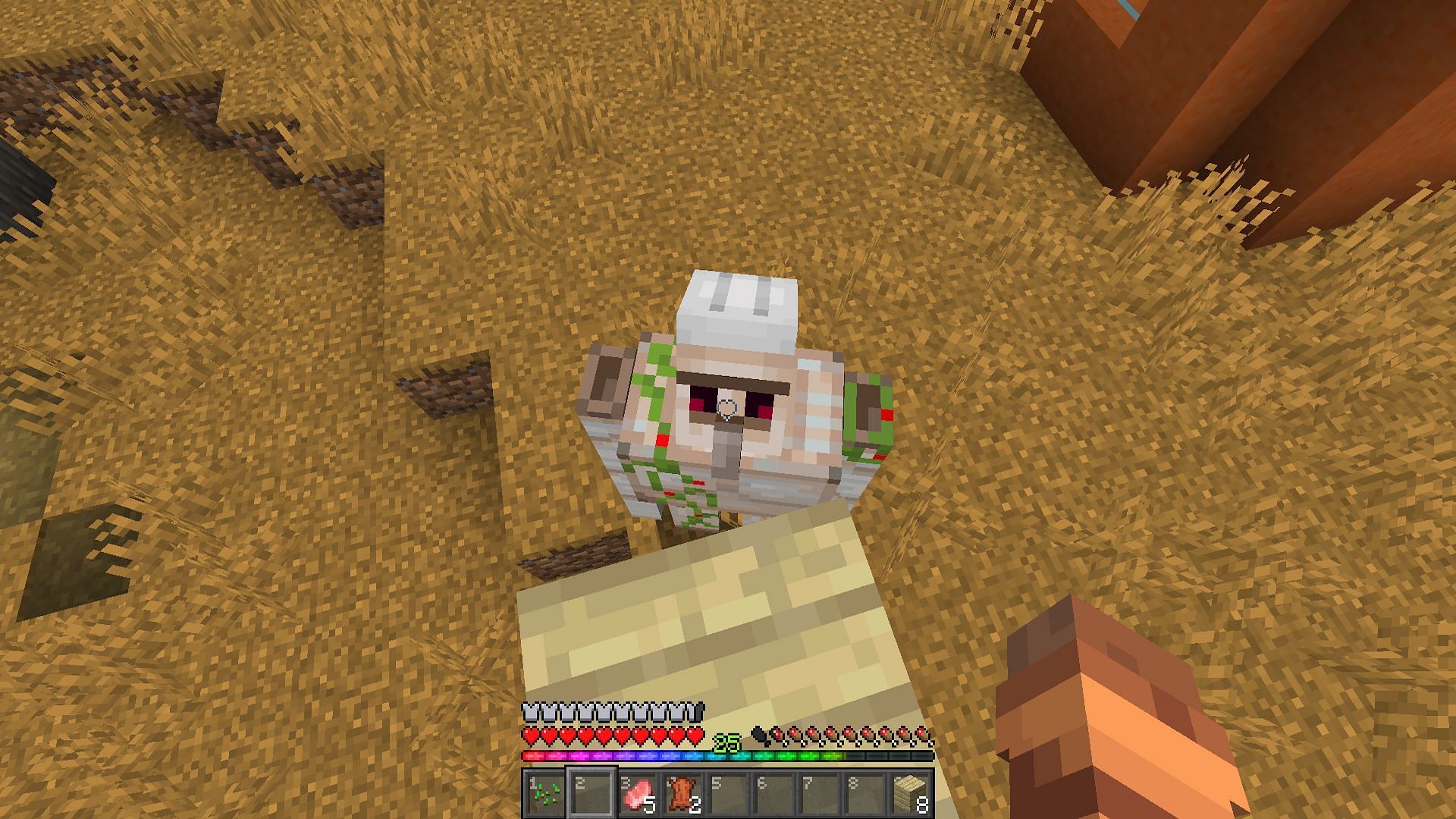 Killing an iron golem from a pillar (Image via Mojang)