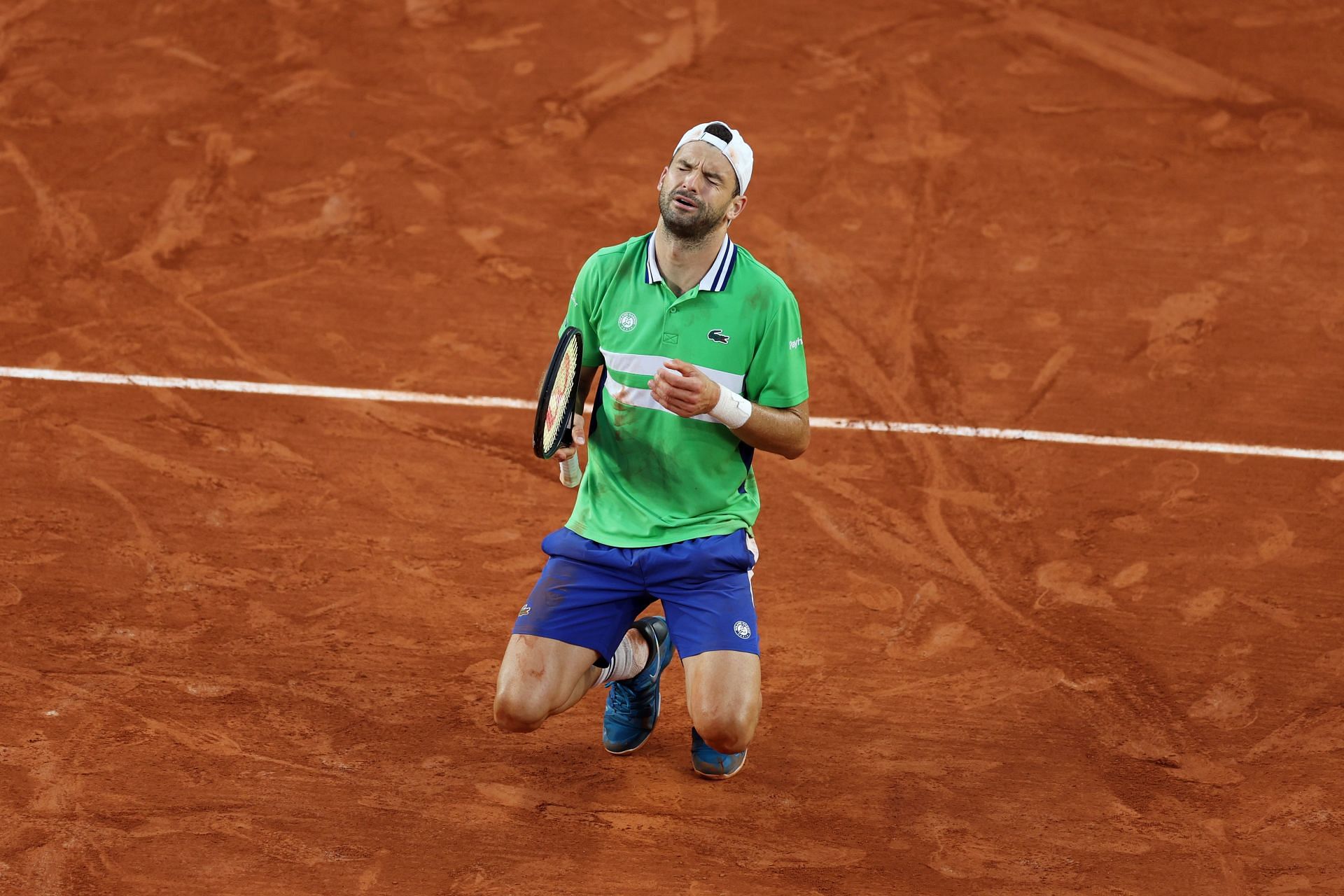 Grigor Dimitrov reacts after reaching the quarterfinals at the 2024 French Open