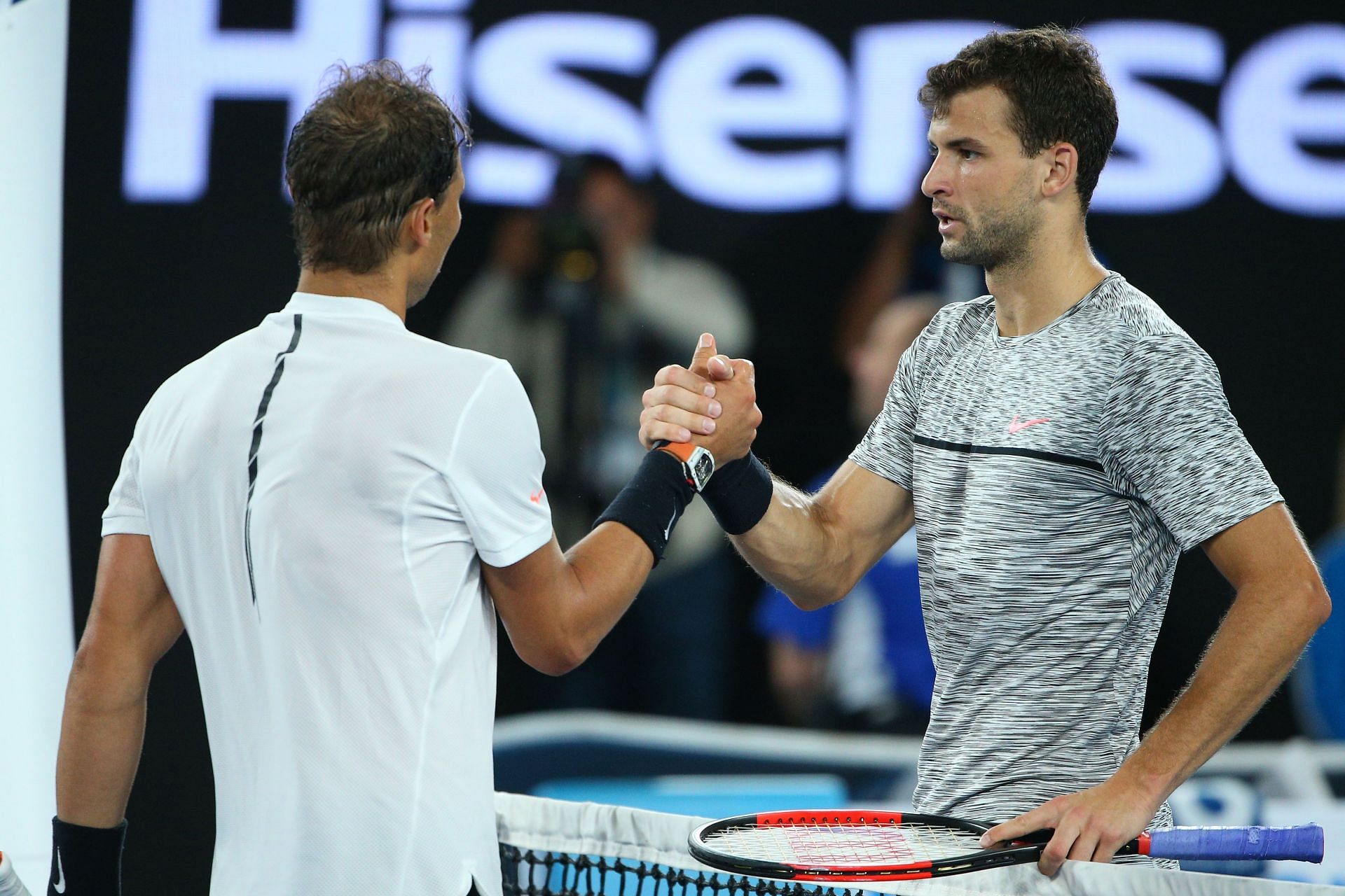 Rafael Nadal and Grigor Dimitrov embrace after their 2017 Australian Open clash