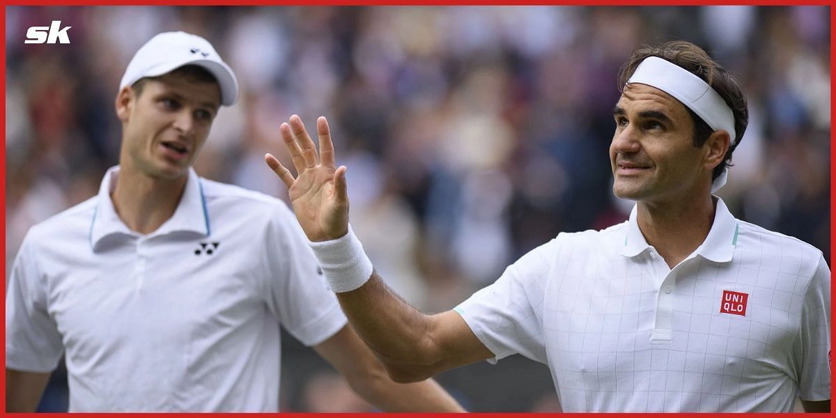 Hubert Hurkacz and Roger Federer at Wimbledon 2021.