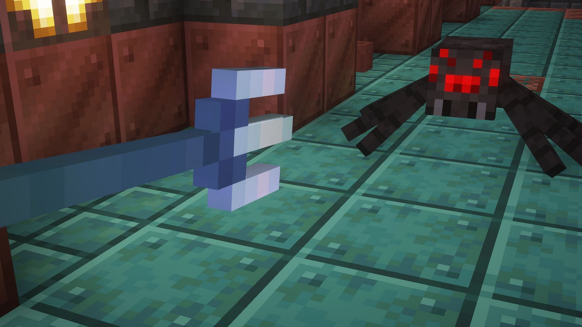 A player throwing a trident at a spider (Image via Mojang)