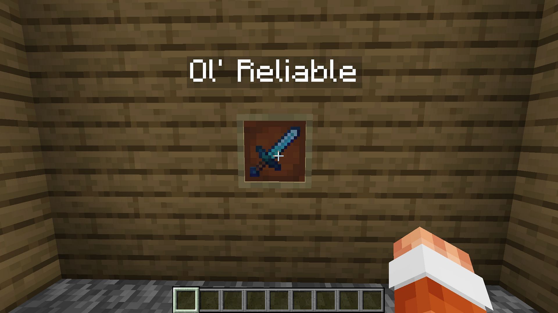 An enchanted diamond sword&#039;s text is reverted to white while in an item frame (Image via Mojang)