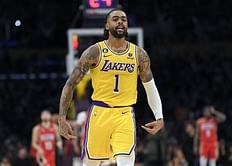 Lakers' D'Angelo Russell puffs on a cigar and sports funky sunglasses as he enjoys yacht getaway