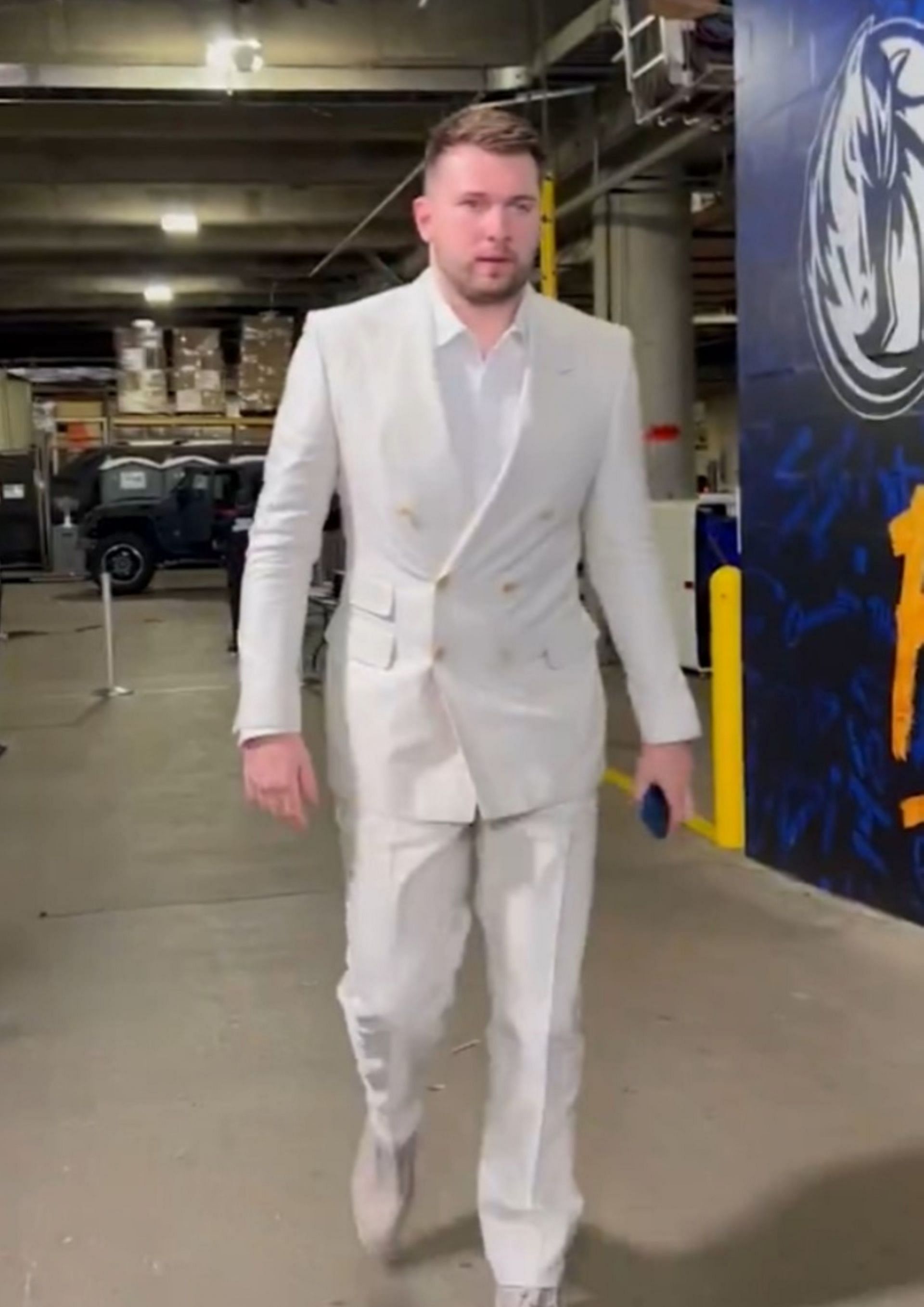 Doncic wears an all-white suit for Game 3.