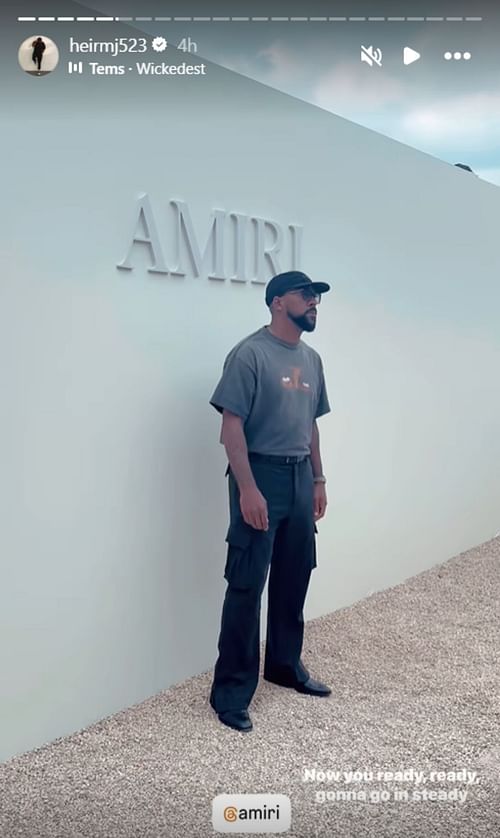 Marcus rocks an all-black ensemble at the Amiri fashion show