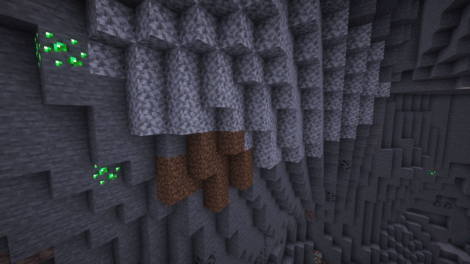 Emerald ore found within a mountain biome (Image via Mojang)