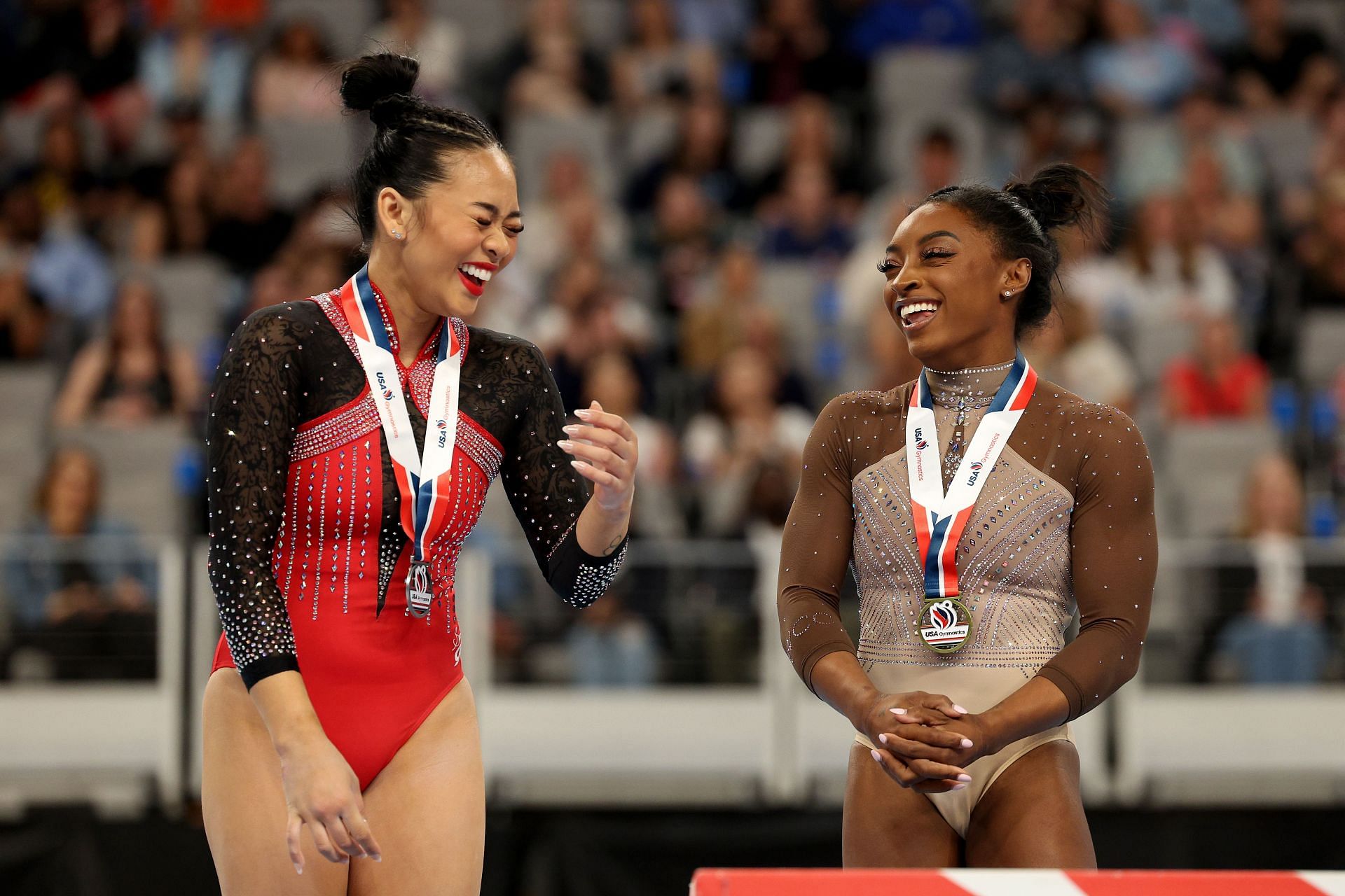 Sunisa Lee and Simone Biles celebrate during the podium ceremony for the balance beam during the 2024 Xfinity U.S. Gymnastics Championships at Dickies Arena on June 02, 2024 in Fort Worth, Texas.