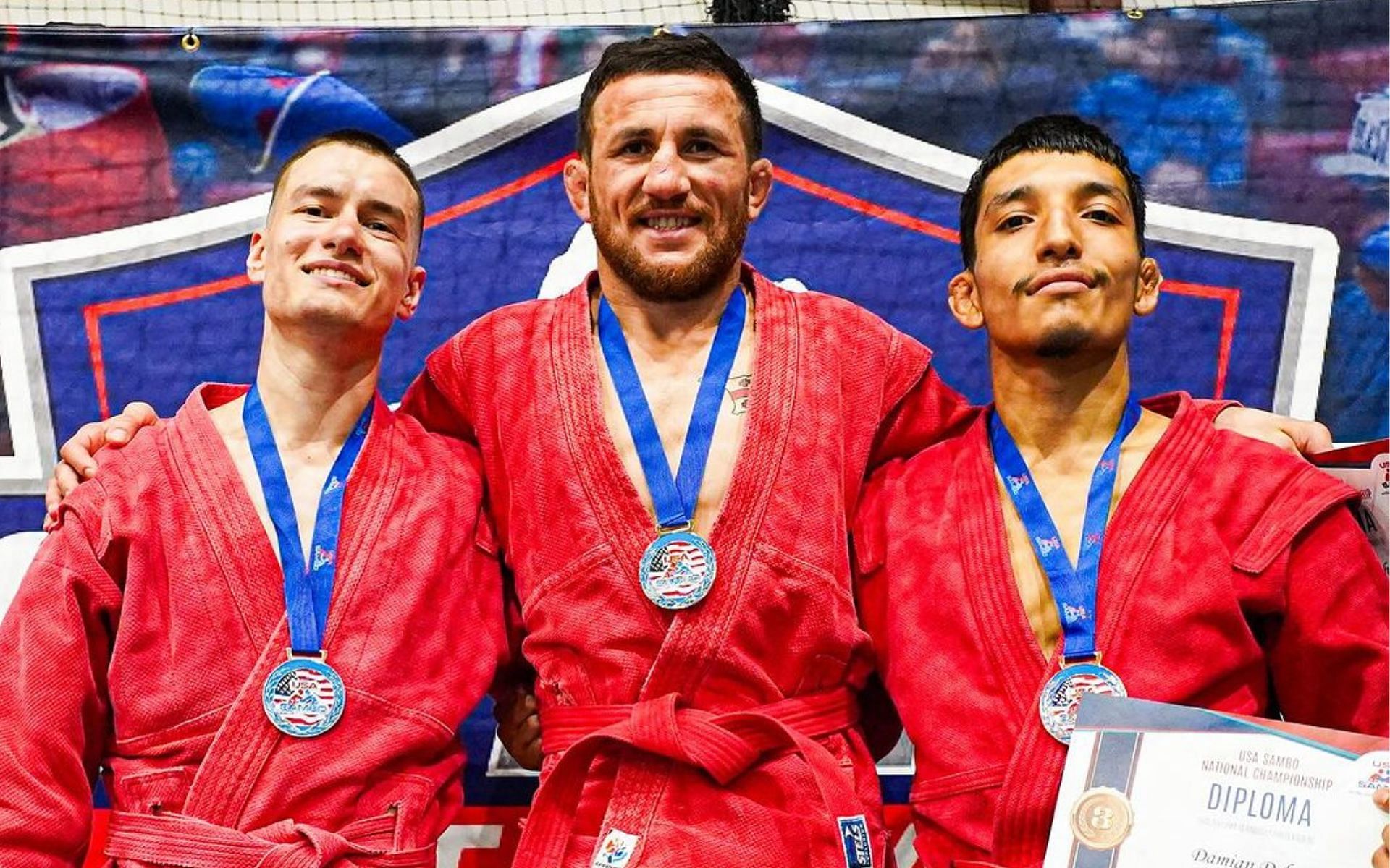 Merab Dvalishvili (middle) poses for pictures on the podium after his win. [Image courtesy @merab.dvalishvili on Instagram]