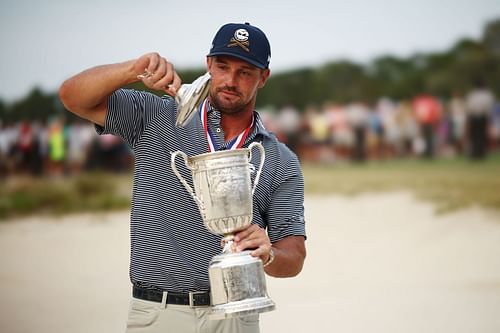 Bryson DeChambeau poses after winning the US Open 2024