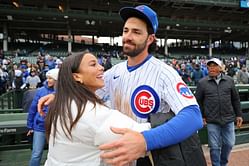 PHOTO: Dansby Swanson sports black suit & white tee while wife Mallory Swanson turns heads in off-shoulder dress at Cubs fundraiser event