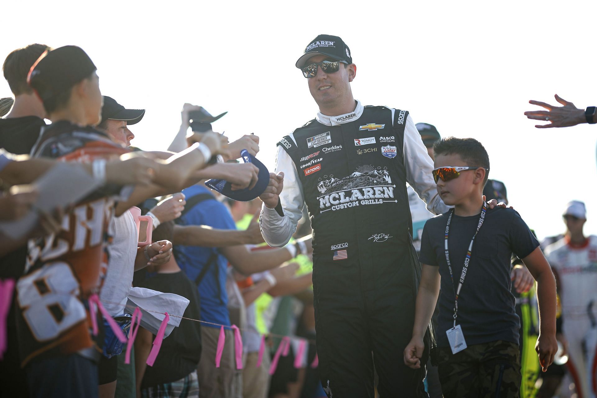 Kyle Busch, greets fans with his son, Brexton Busch during pre-race ceremonies prior to the NASCAR Cup Series Cook Out Southern 500 at Darlington Raceway on September 03, 2023 in Darlington, South Carolina. (Photo by James Gilbert/Getty Images)