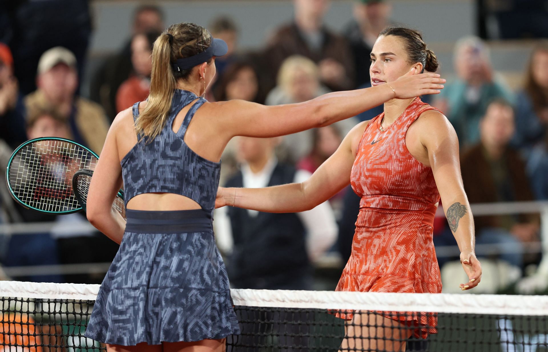 Paula Badosa and Aryna Sabalenka embrace during the 2024 French Open.