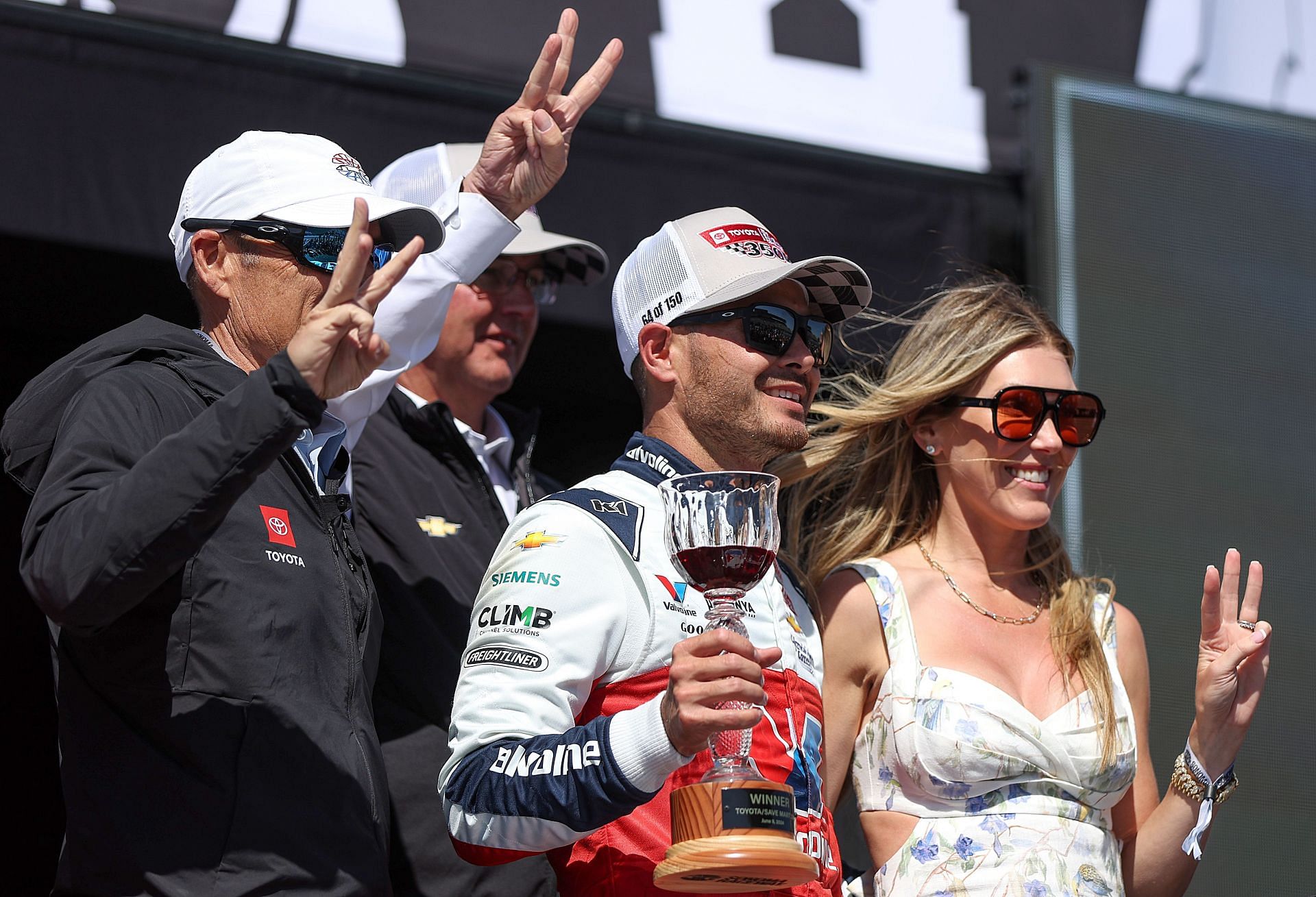 Kyle Larson, driver of the #5 Valvoline Chevrolet, and wife, Katelyn Larson celebrate in victory lane after winning the NASCAR Cup Series Toyota/Save Mart 350 at Sonoma Raceway