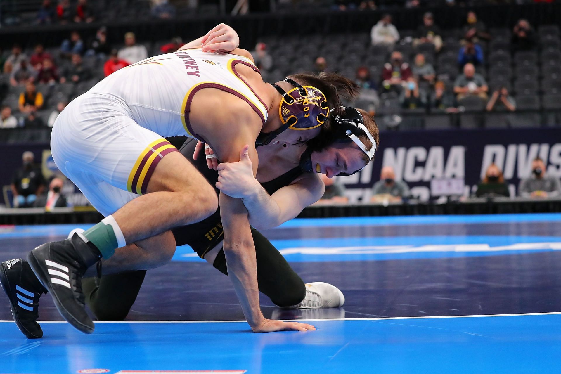 Spencer Lee of Iowa wrestles Brandon Courtney of Arizona State in the 125lb weight class in the first-place match during the NCAA Division I Men&#039;s Wrestling Championship at the Enterprise Center on March 20, 2021 in St Louis, Missouri. (Photo by Dilip Vishwanat/Getty Images)