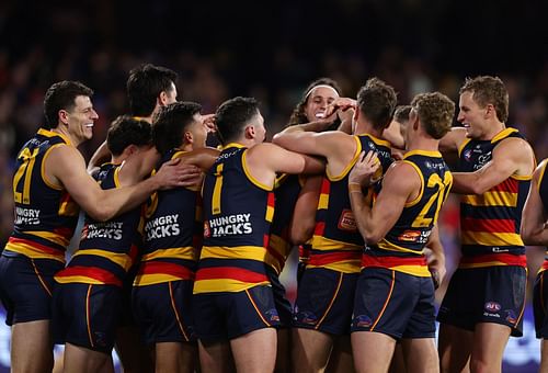 Adelaide players celebrate against Richmond