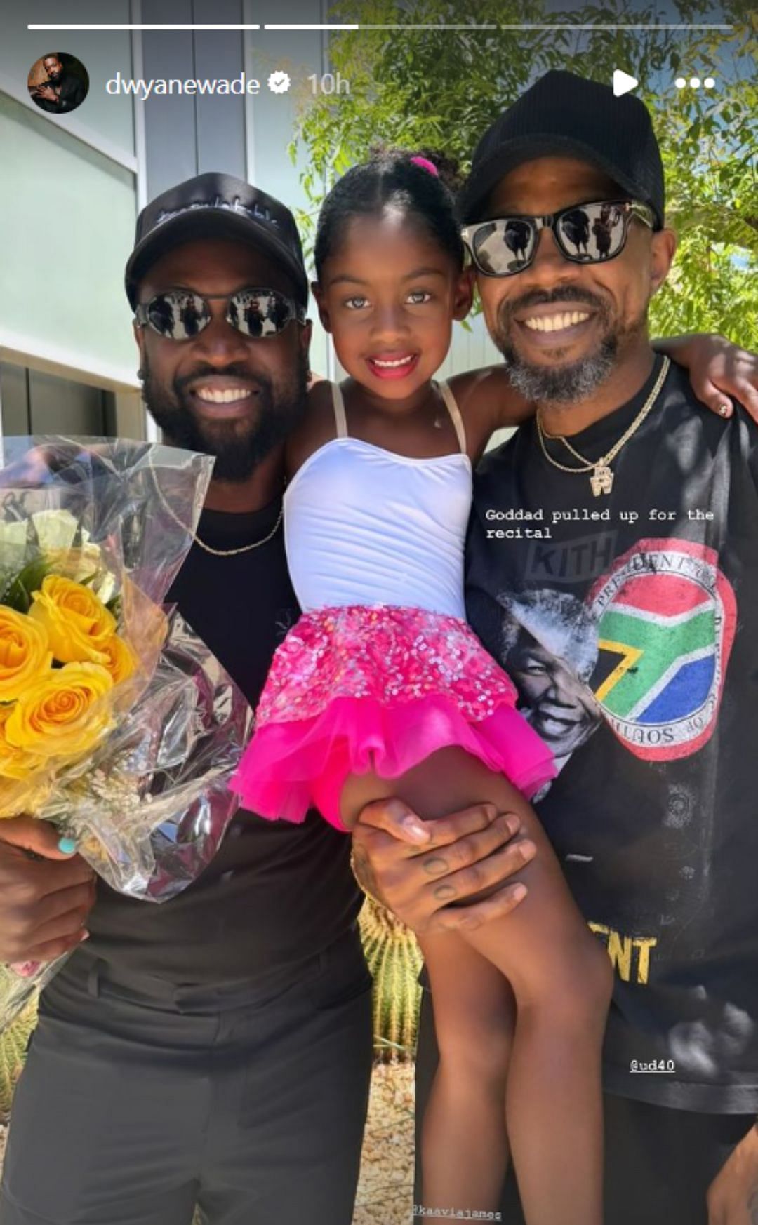 Kaavia poses with her dad and &quot;goddad&quot; at her recital (Image: Wade&#039;s Instagram story)