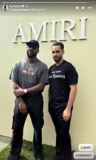 Marcus poses with Mike Amiri at the Amiri fashion show