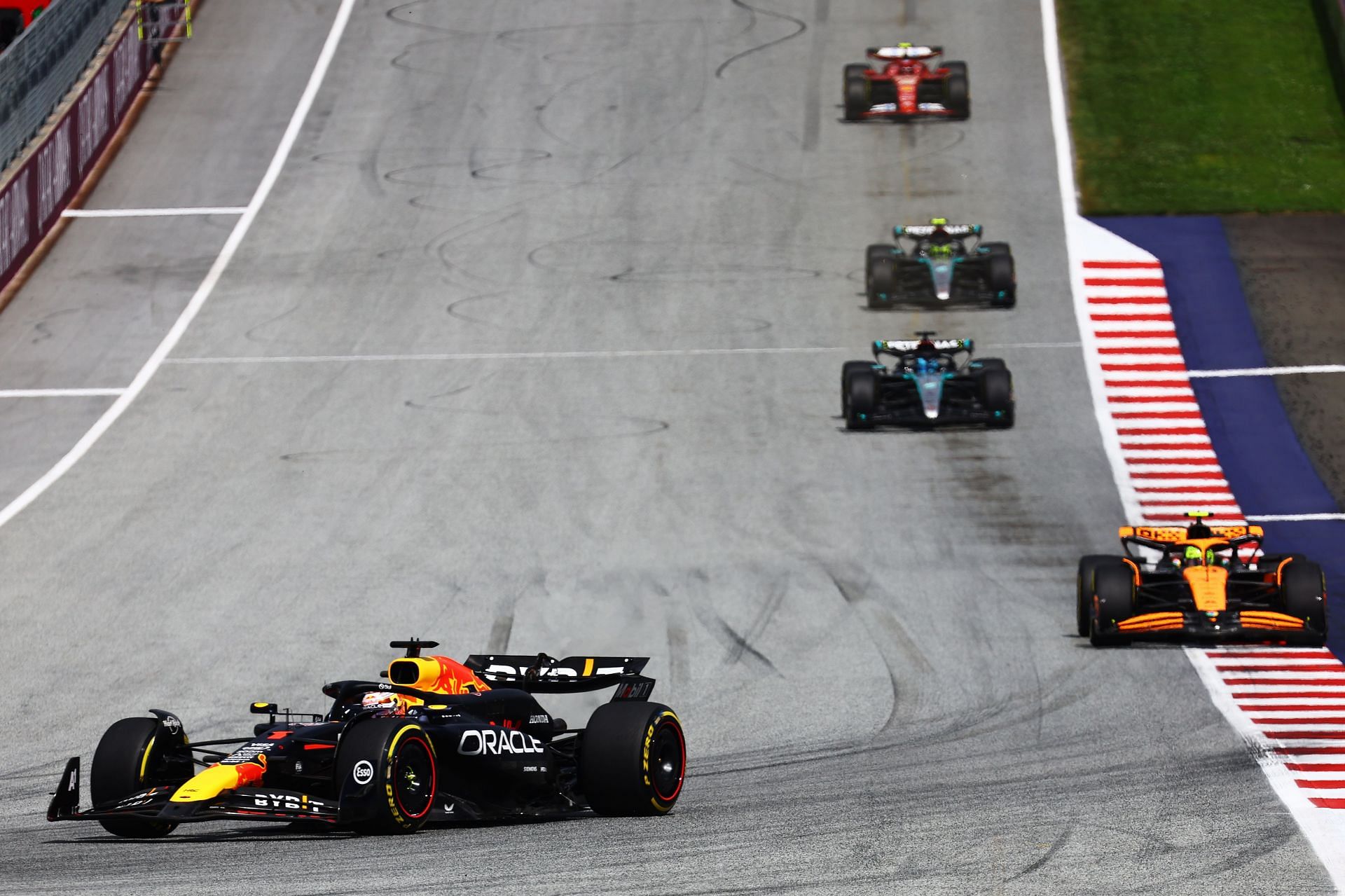 Max Verstappen of the Netherlands driving the (1) Oracle Red Bull Racing RB20 leads Lando Norris of Great Britain driving the (4) McLaren MCL38 Mercedes during the F1 Grand Prix of Austria at Red Bull Ring on June 30, 2024 in Spielberg, Austria. (Photo by Mark Thompson/Getty Images)