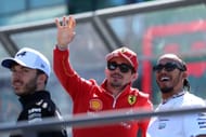 Charles Leclerc of Monaco and Ferrari and Lewis Hamilton of Great Britain and Mercedes talk on the drivers parade prior to the F1 Grand Prix of Australia at Albert Park Circuit on March 24, 2024 in Melbourne, Australia. (Photo by Robert Cianflone/Getty Images)