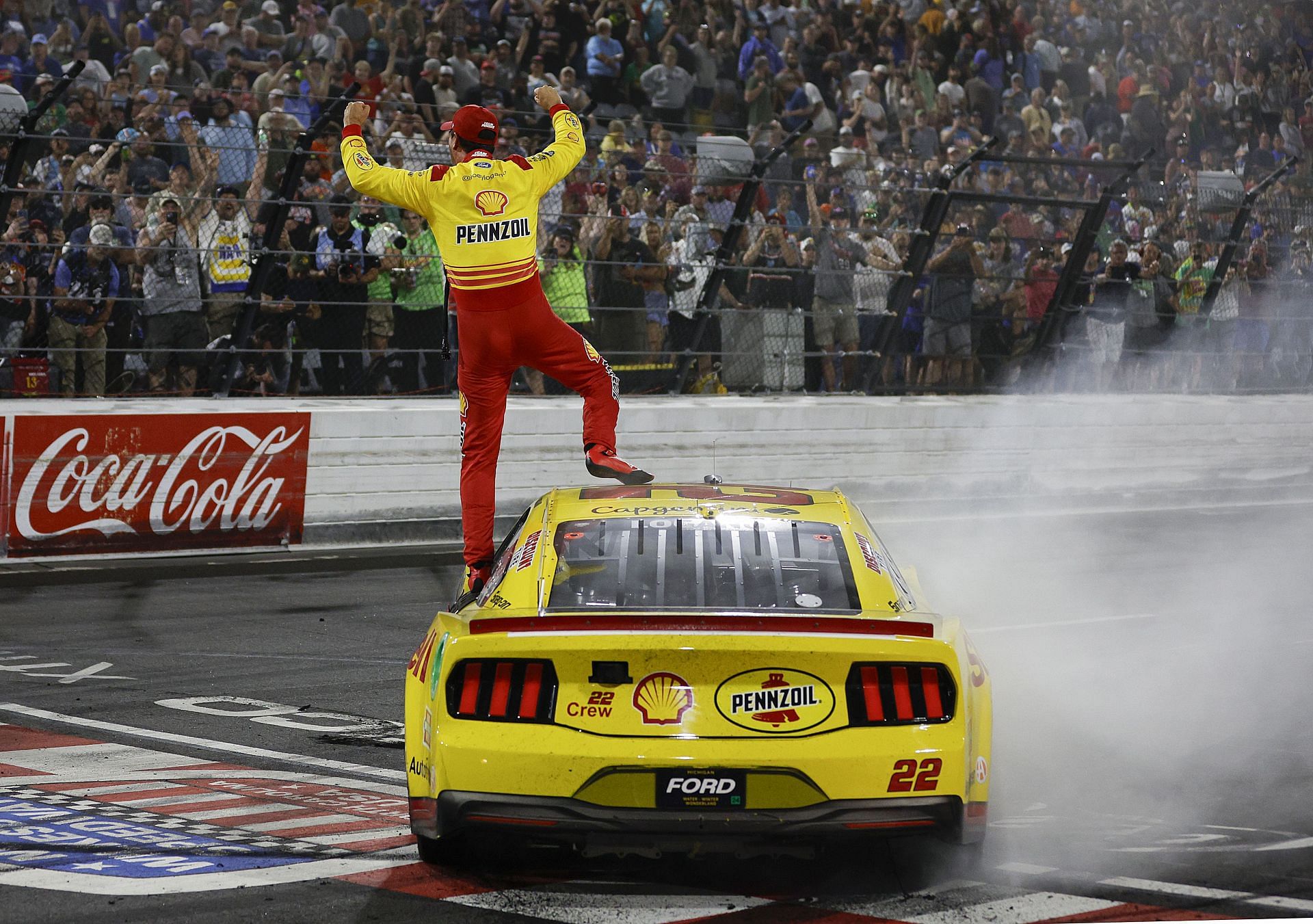 Joey Logano celebrates after winning the NASCAR Cup Series All-Star Race