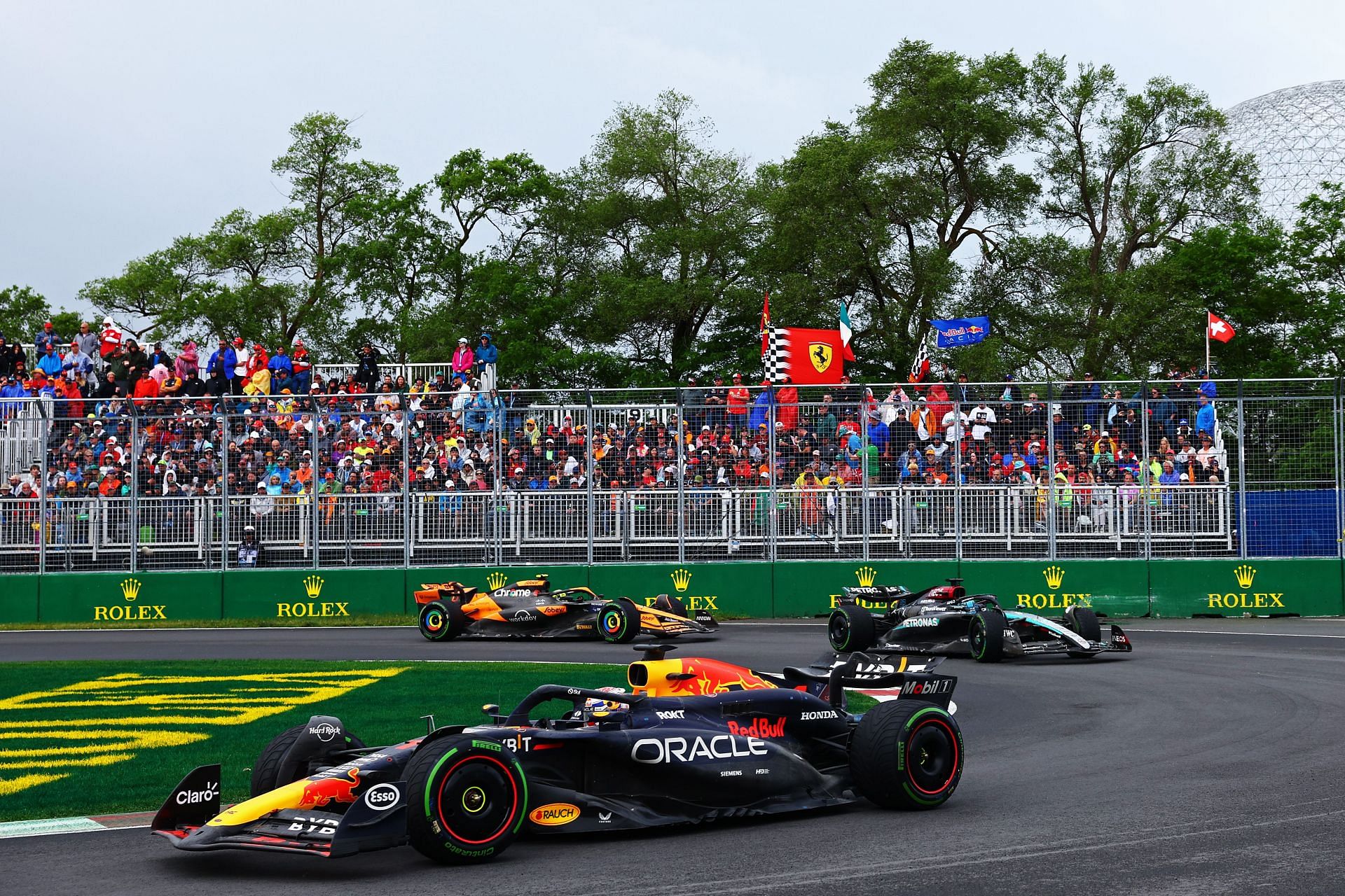 Max Verstappen driving the (1) Oracle Red Bull Racing RB20 leads George Russell of Great Britain driving the (63) Mercedes AMG Petronas F1 Team W15 on track during the F1 Grand Prix of Canada at Circuit Gilles Villeneuve on June 09, 2024 in Montreal, Quebec. (Photo by Clive Rose/Getty Images)