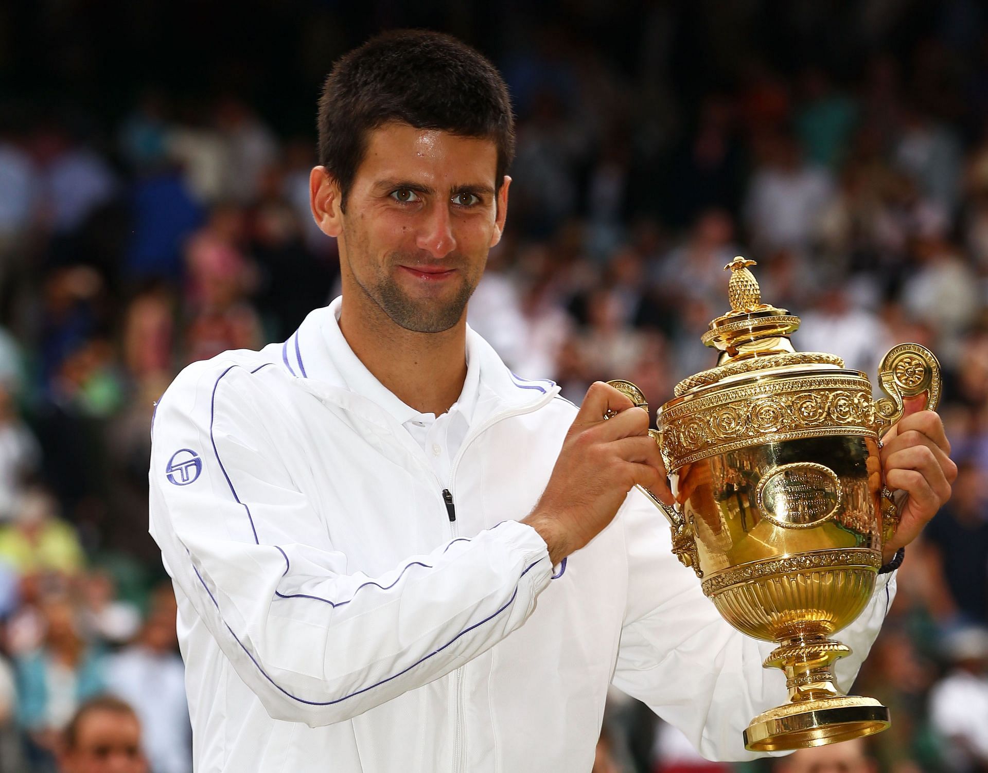 Novak Djokovic holds the 2011 Wimbledon men&#039;s singles trophy. (Photo: Getty)