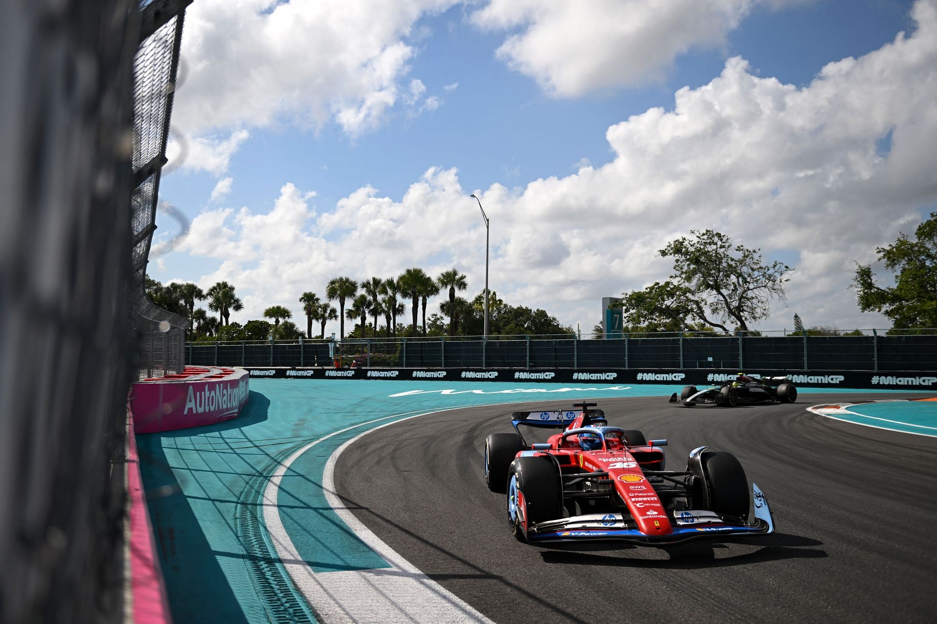 MIAMI, FLORIDA - MAY 05: Charles Leclerc of Monaco driving the (16) Ferrari SF-24 leads Lewis Hamilton of Great Britain driving the (44) Mercedes AMG Petronas F1 Team W15 on track during the F1 Grand Prix of Miami at Miami International Autodrome on May 05, 2024 in Miami, Florida. (Photo by Rudy Carezzevoli/Getty Images)