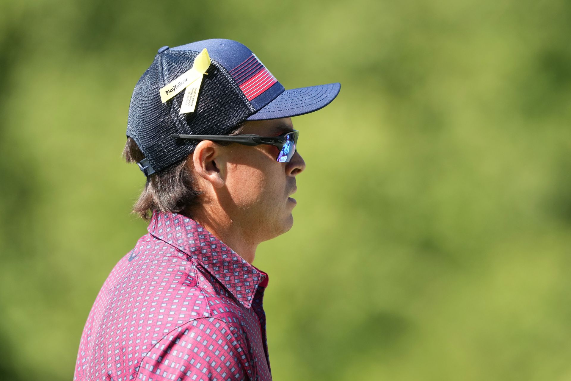 Rickie Fowler at the 2024 Memorial Tournament with a yellow ribbon