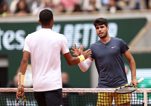 Carlos Alcaraz and Felix Auger-Aliassime shake hands after their French Open clash